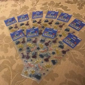 Bundle of 10 packs of glitter accessory stickers.